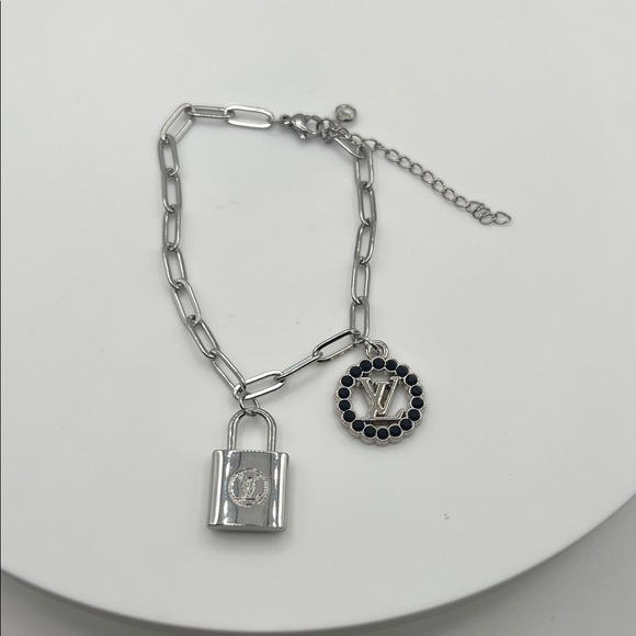 1448. Elegant LV zipper pull / charm on a bracelet